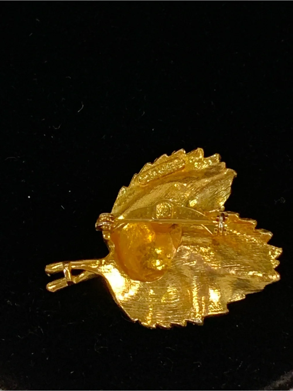 Beautiful vintage Marvella brooch in the shape of a curled leaf, done in brushed